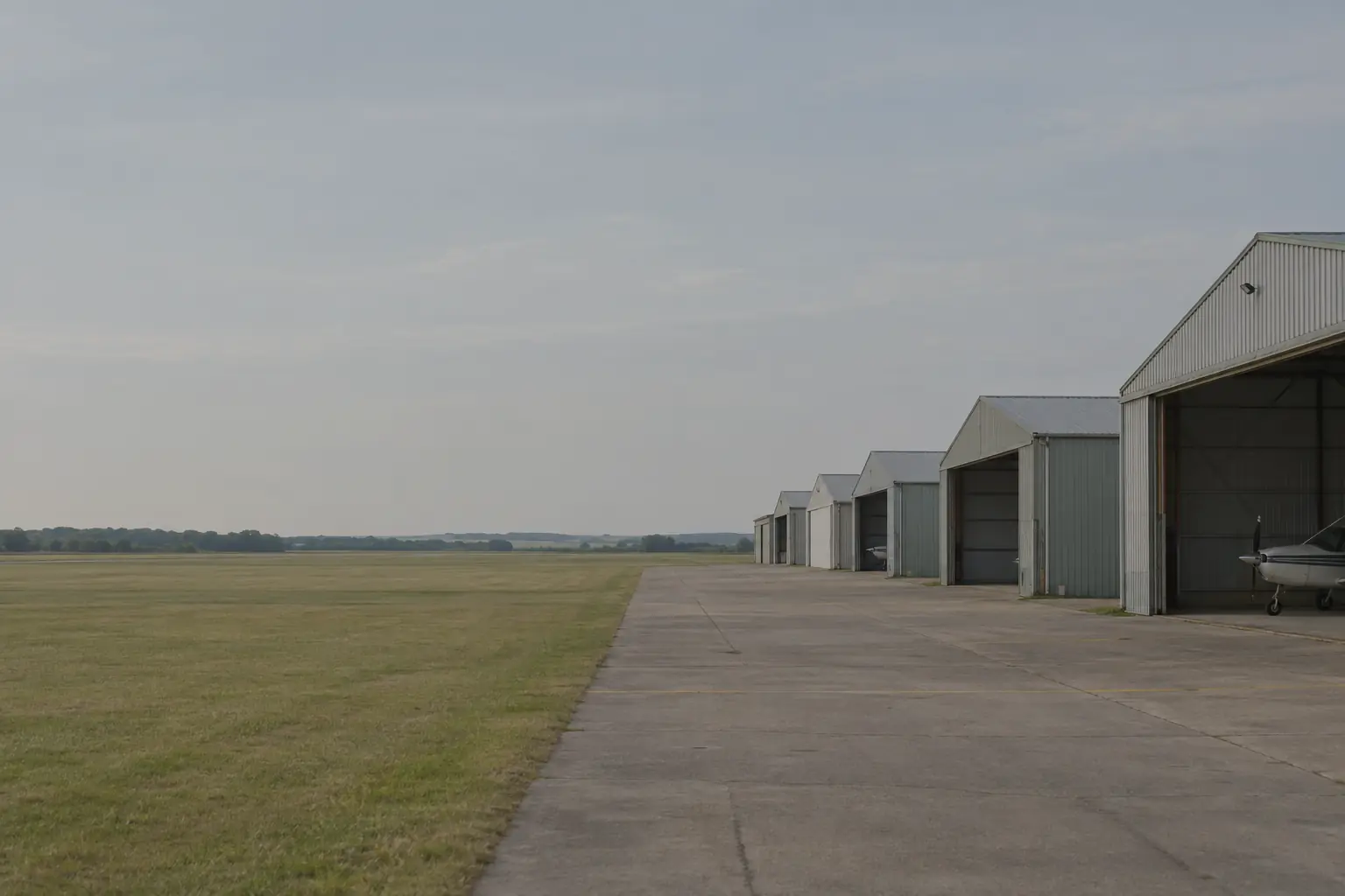 A flat airfield under a wide sky