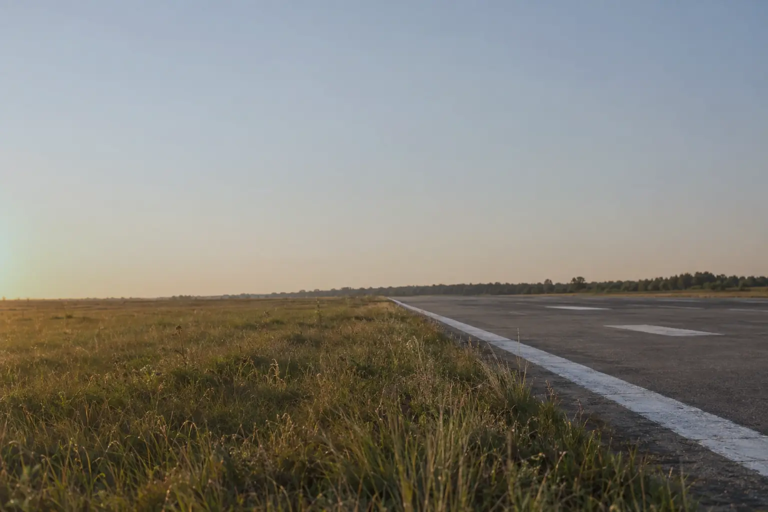 The edge of the runway at golden hour