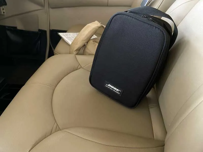 Closed Bose A20 headset bag on an aircraft seat