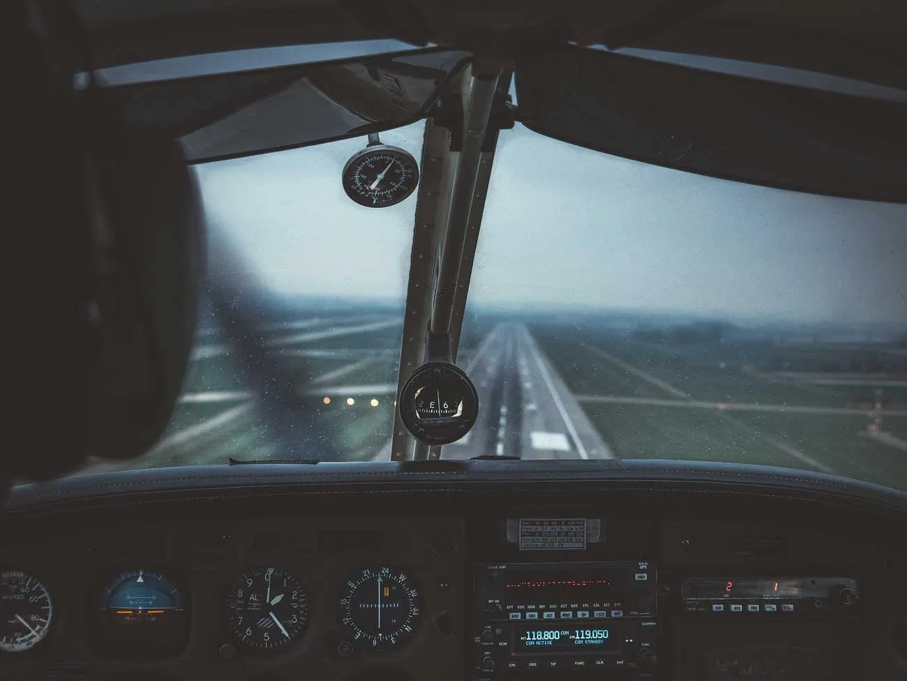 Small plane flying in clouds