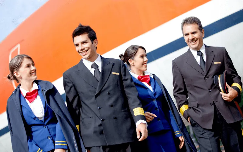 Pilots walking who are senior and junior.