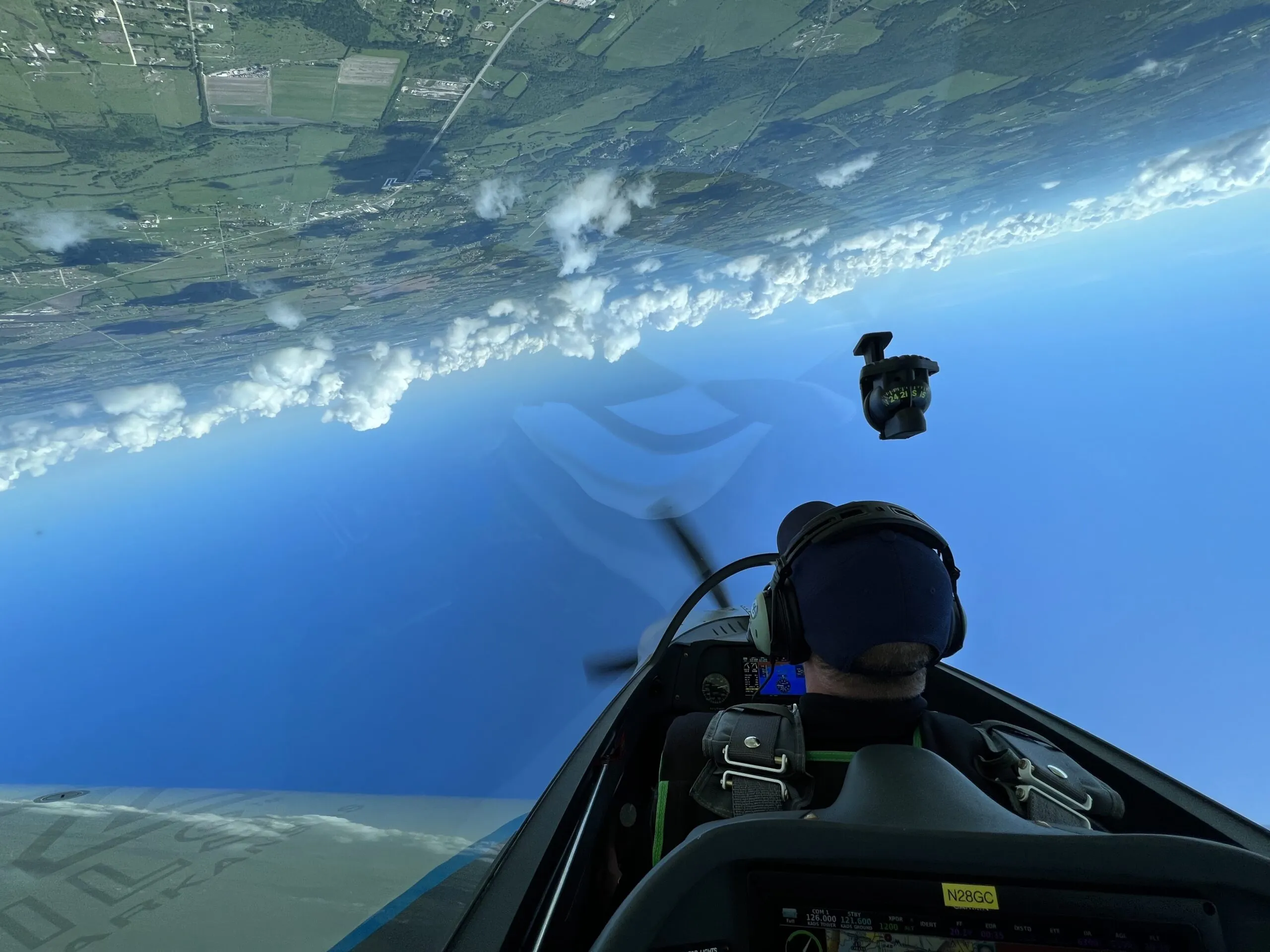 View from the cockpit during an aerobatic maneuver with the horizon inverted