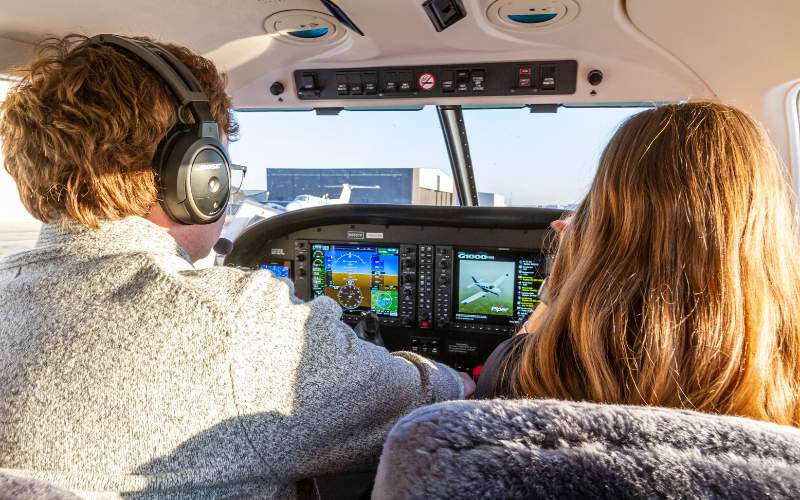 Student pilot and instructor at the Garmin G1000 panel of a Piper Archer