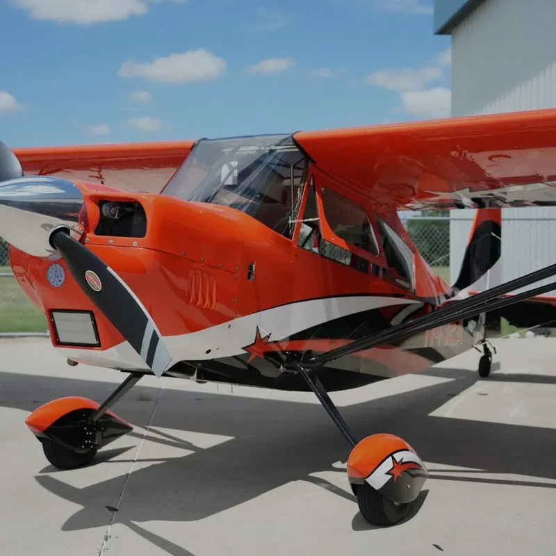 Super Decathlon Fleet Square v3 Orange Super Decathlon aerobatic airplane on the ramp