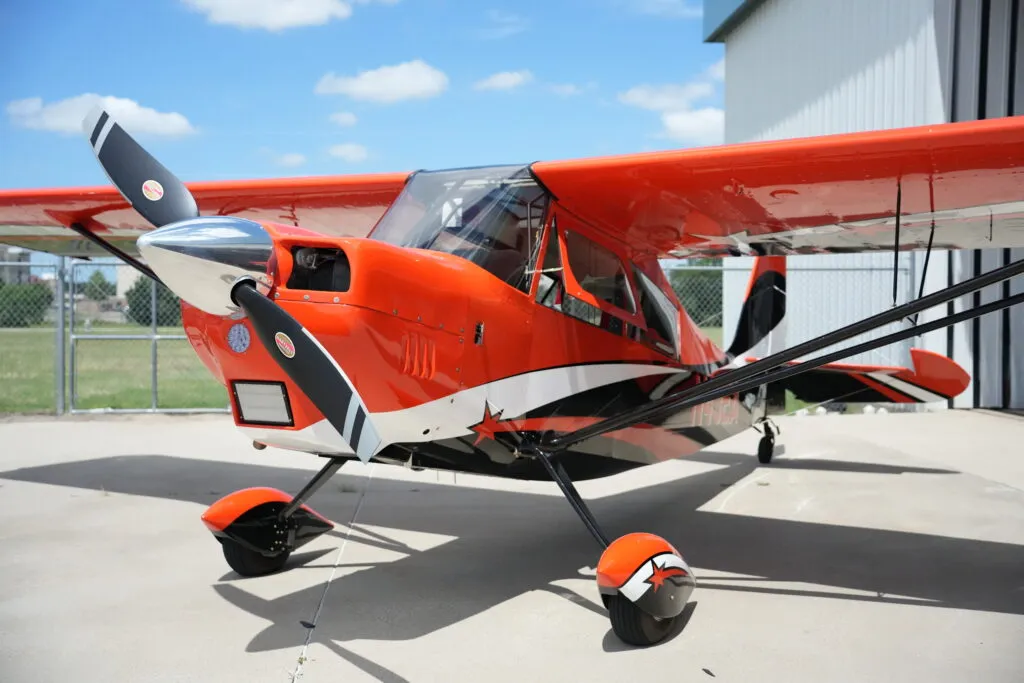 Thrust Flight Super Decathlon aerobatic trainer parked outside the hangar